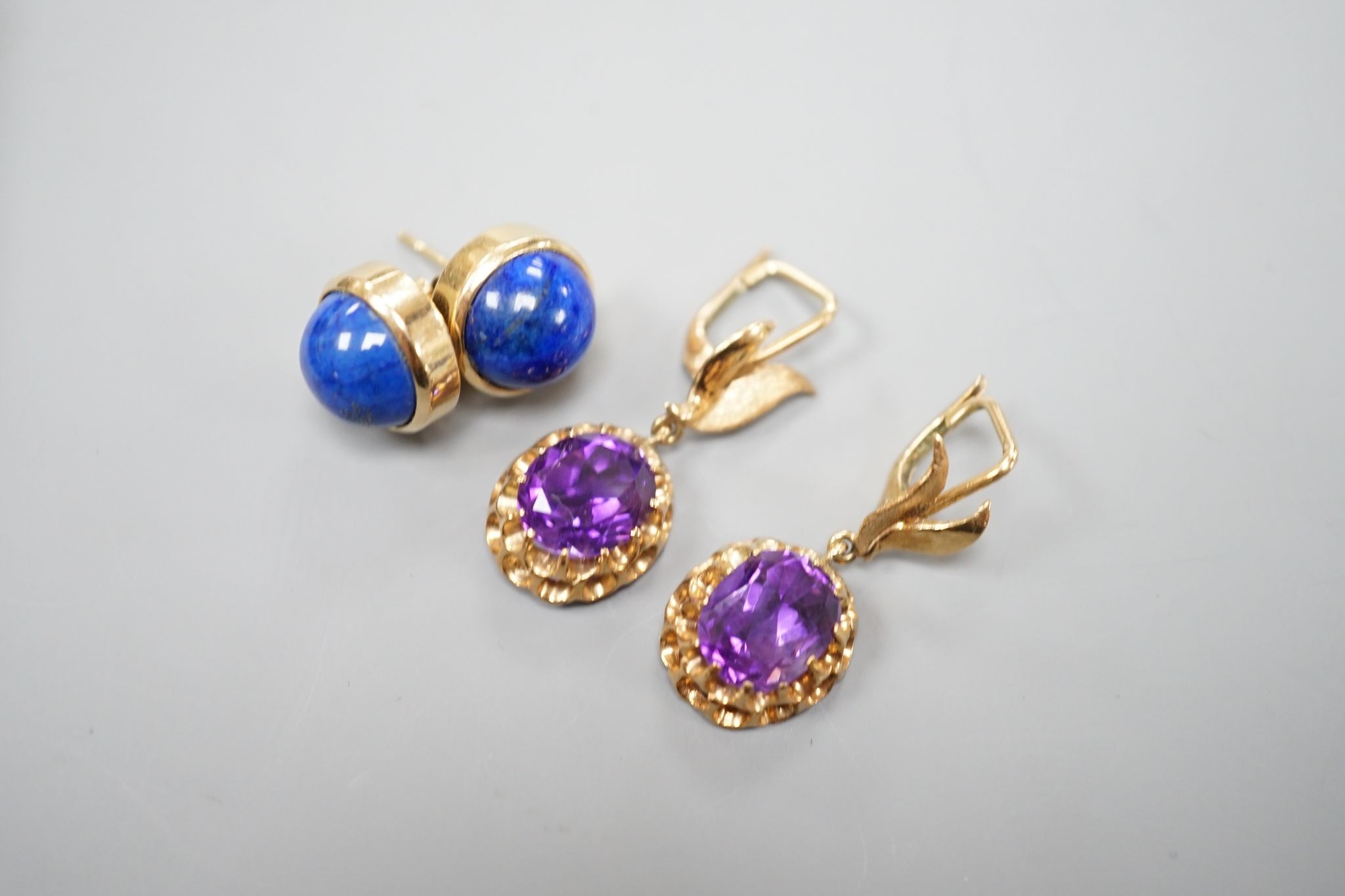 A modern pair of 14k yellow metal and amethyst set drop earrings, 29mm and a similar pair of lapis lazuli set earrings, gross weight 13.9 grams.